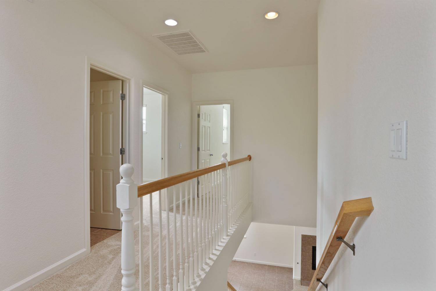 9363 Vintner Circle Patterson, CA 95363 - Photo 24 of 52 a view of a hallway with staircase