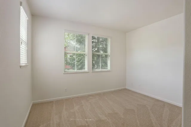 an empty room with mirror in it