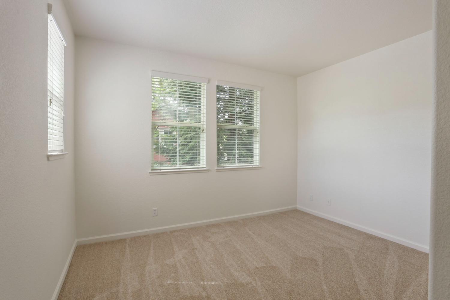 9363 Vintner Circle Patterson, CA 95363 - Photo 29 of 52 an empty room with windows