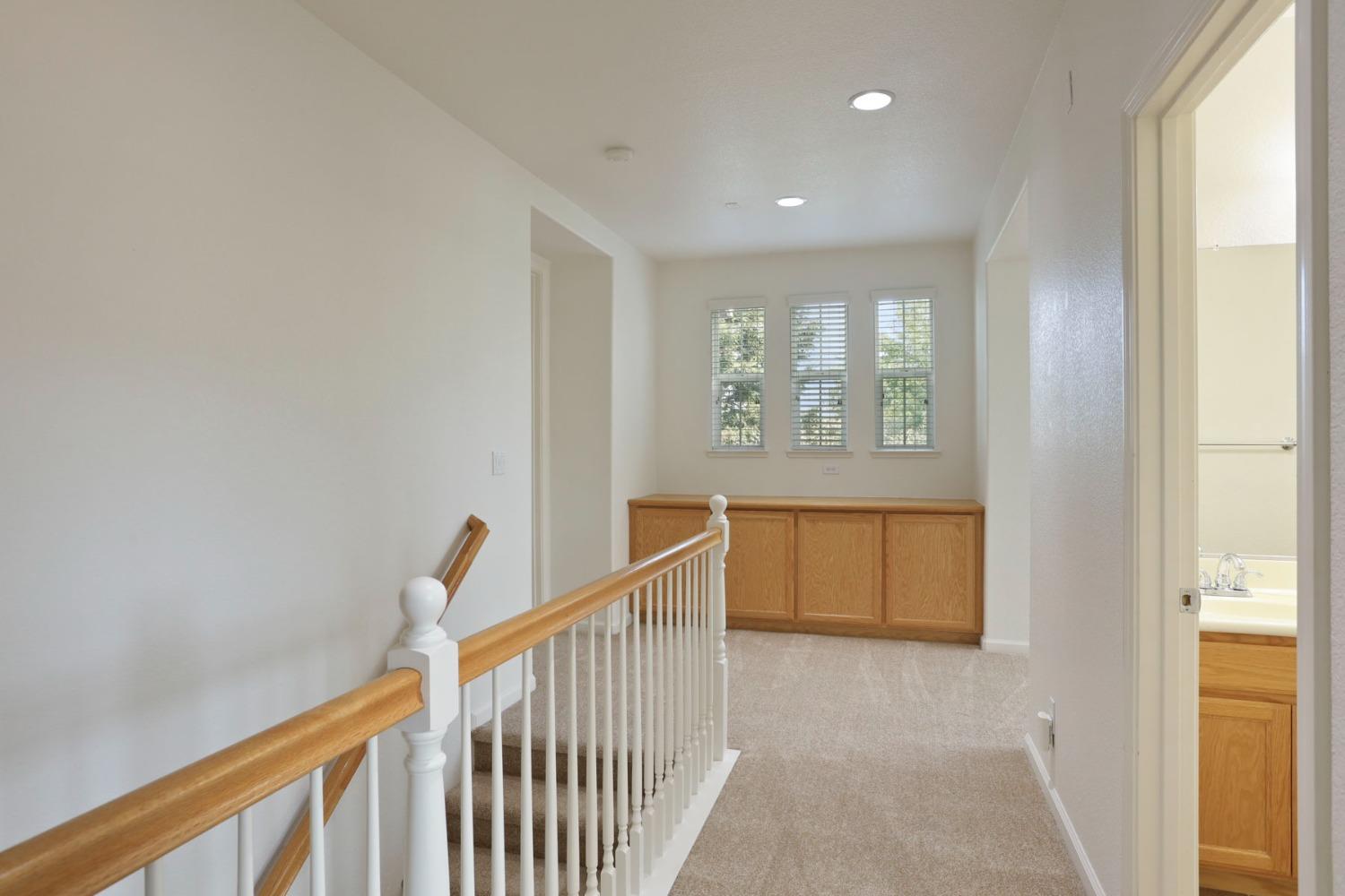9363 Vintner Circle Patterson, CA 95363 - Photo 31 of 52 a view of hallway with stairs