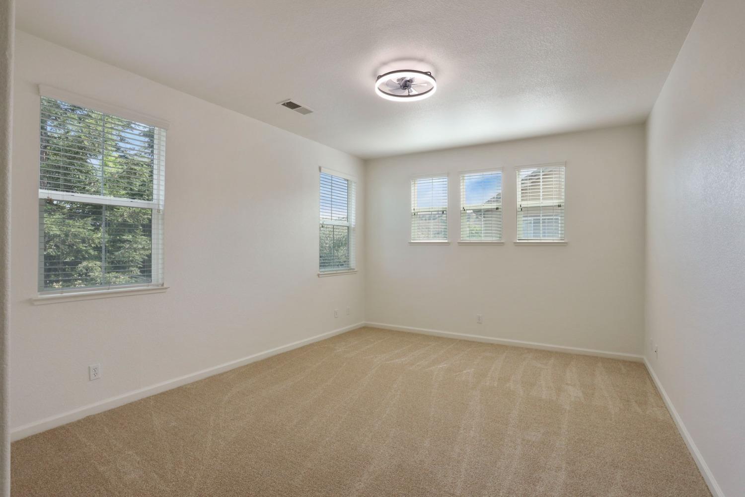 9363 Vintner Circle Patterson, CA 95363 - Photo 32 of 52 an empty room with windows