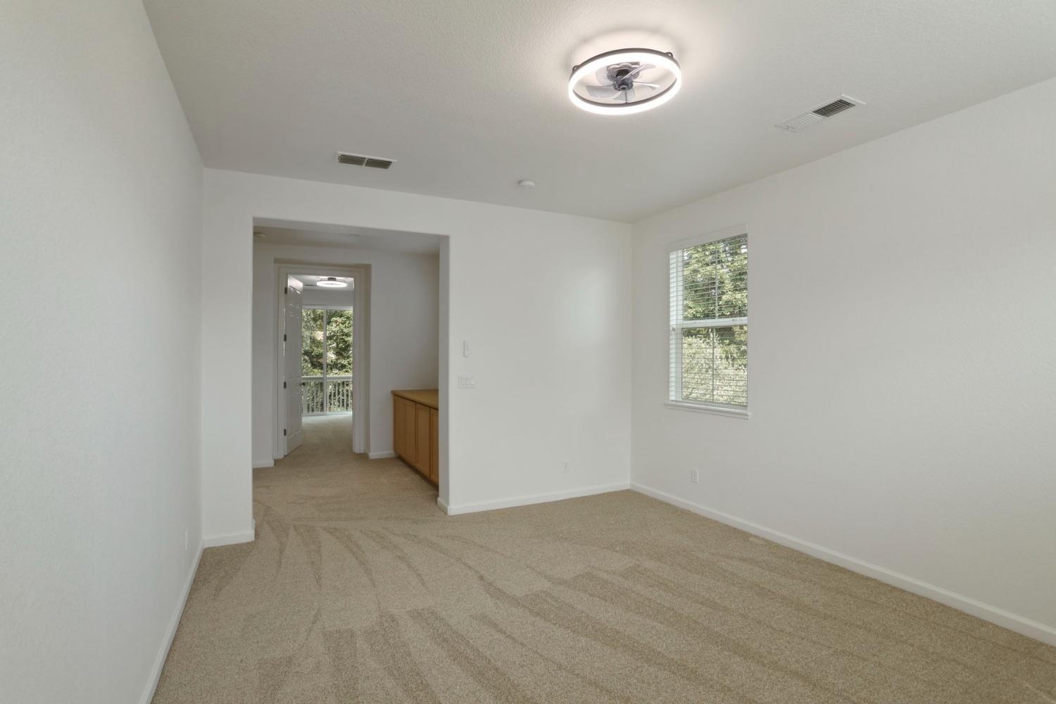 9363 Vintner Circle Patterson, CA 95363 - Photo 33 of 52 an empty room with windows and closet