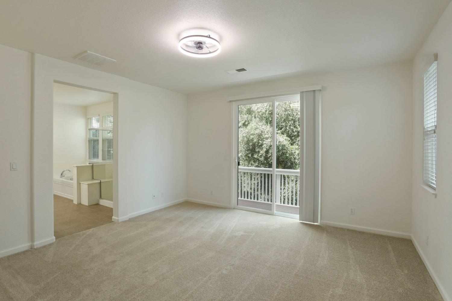 9363 Vintner Circle Patterson, CA 95363 - Photo 35 of 52 an empty room with windows and closet