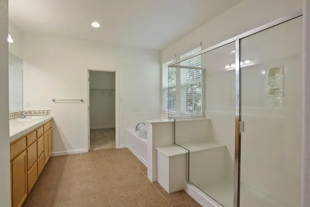 a bathroom with a bathtub and a shower