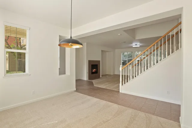 a view of a room with a window and fireplace
