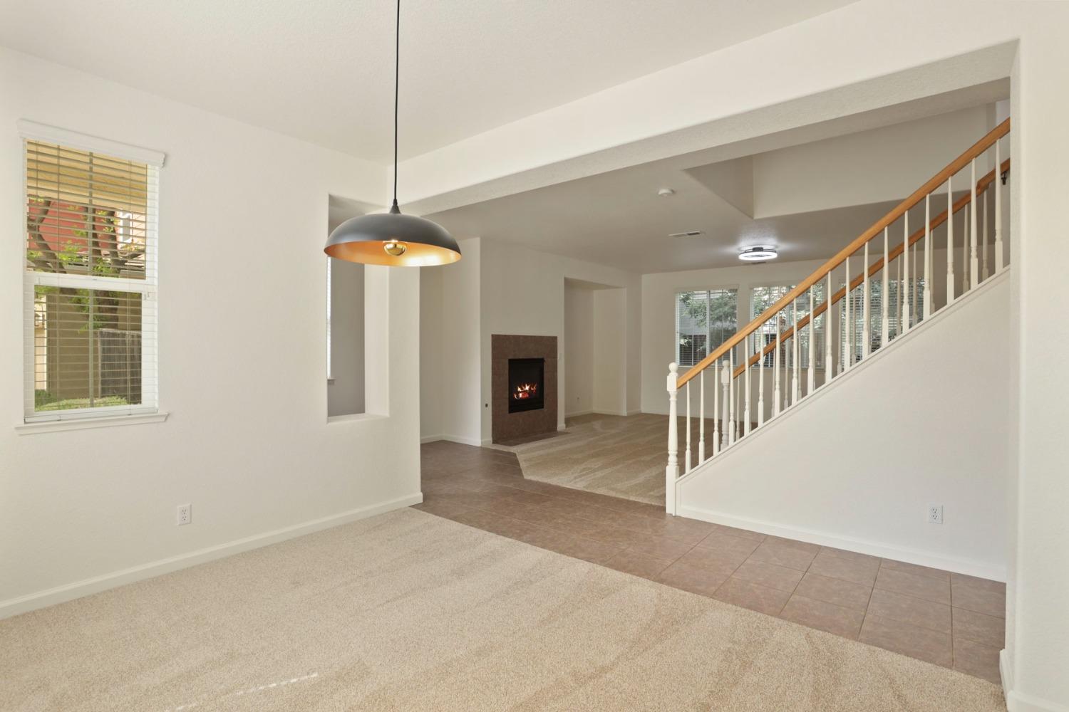 9363 Vintner Circle Patterson, CA 95363 - Photo 6 of 52 a view of a room with a window and fireplace