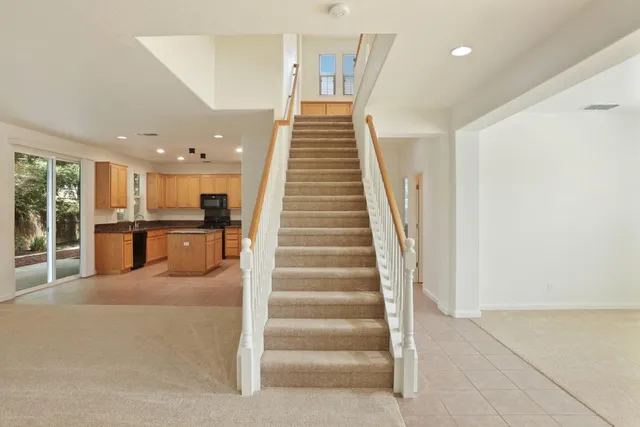 a view of staircase with white walls