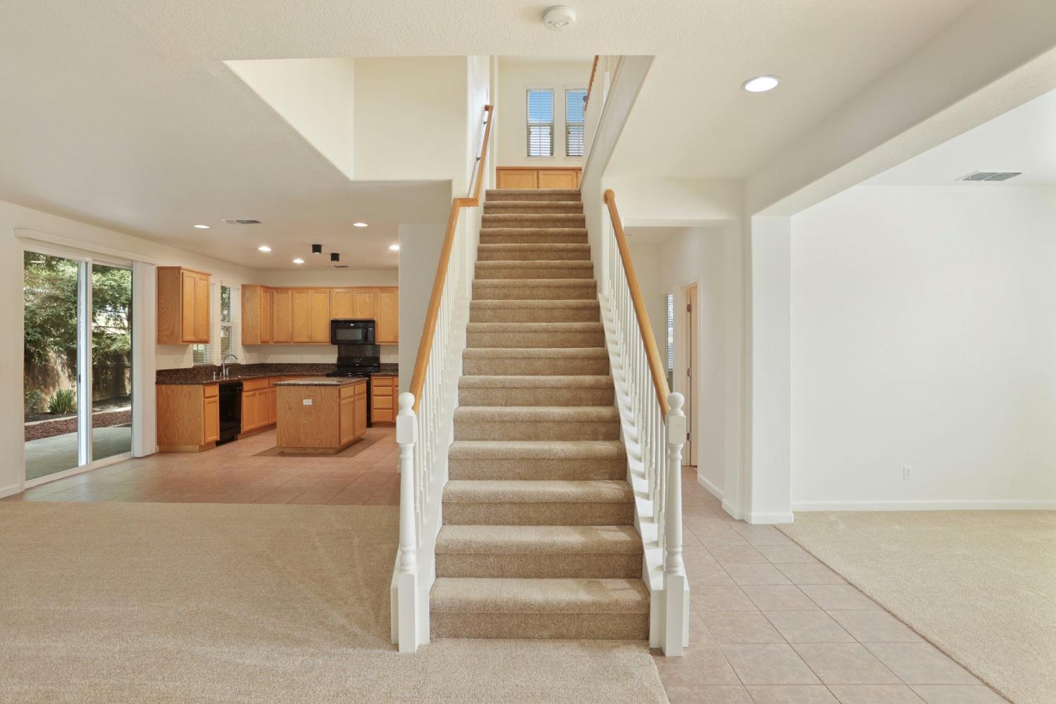 9363 Vintner Circle Patterson, CA 95363 - Photo 8 of 52 a view of staircase with white walls
