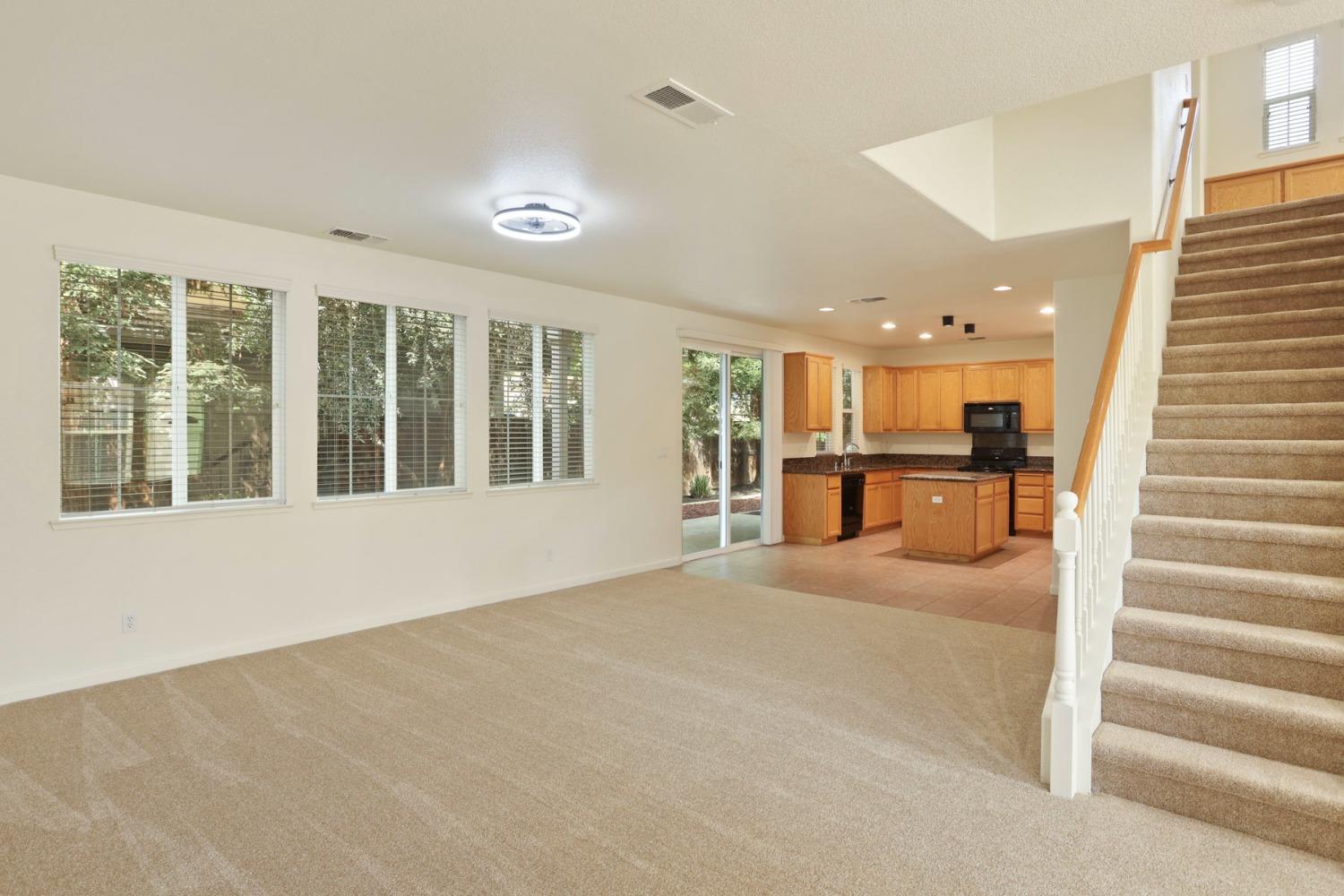 9363 Vintner Circle Patterson, CA 95363 - Photo 9 of 52 a view of an empty room with a window