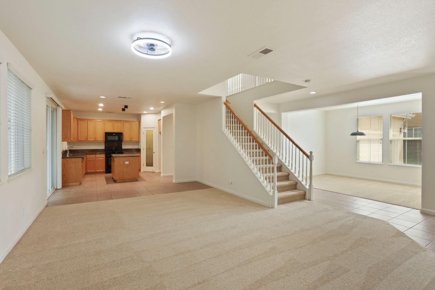 9363 Vintner Circle Patterson, CA 95363 - Photo 10 of 52 a view of a kitchen with furniture and a kitchen