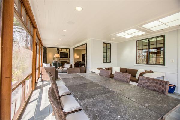 103 Rolling Lane Weston, MA 02493 - Photo 11 of 25 a living room with furniture and a large window