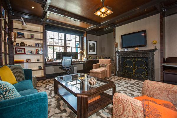 103 Rolling Lane Weston, MA 02493 - Photo 16 of 25 a living room with furniture a flat screen tv and a fireplace