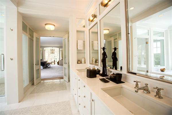 103 Rolling Lane Weston, MA 02493 - Photo 18 of 25 a bathroom with sink a mirror a bathtub and shower