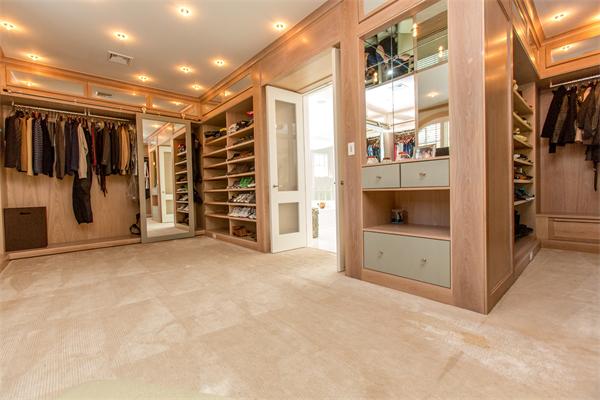 103 Rolling Lane Weston, MA 02493 - Photo 20 of 25 a view of an empty room with furniture and a refrigerator