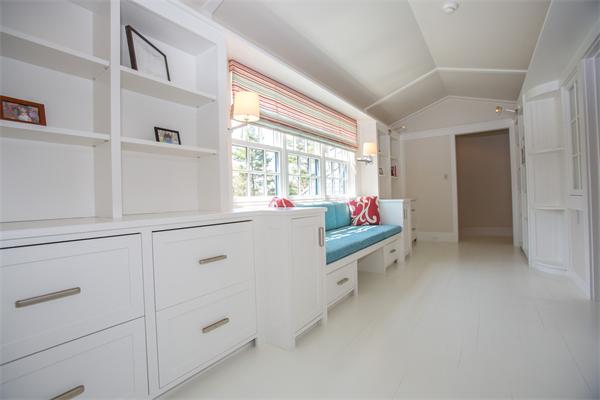 103 Rolling Lane Weston, MA 02493 - Photo 21 of 25 a hallway with white cabinets and white wooden floors