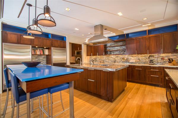 103 Rolling Lane Weston, MA 02493 - Photo 6 of 25 a kitchen with stainless steel appliances kitchen island granite countertop a sink a stove and a wooden floors