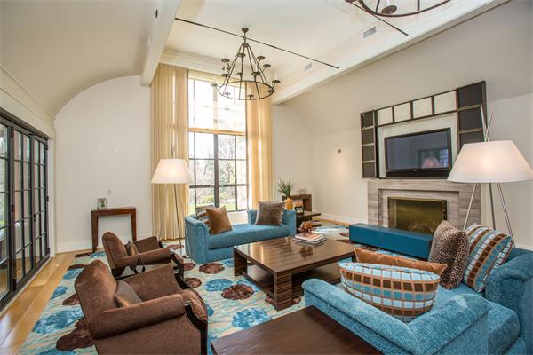 103 Rolling Lane Weston, MA 02493 - Photo 8 of 25 a living room with furniture a fireplace and a chandelier