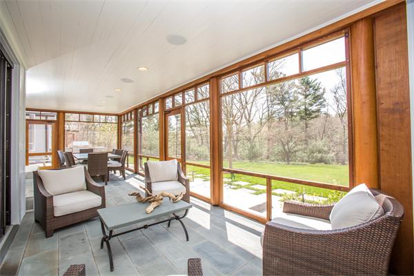 103 Rolling Lane Weston, MA 02493 - Photo 9 of 25 a living room with furniture and a floor to ceiling window