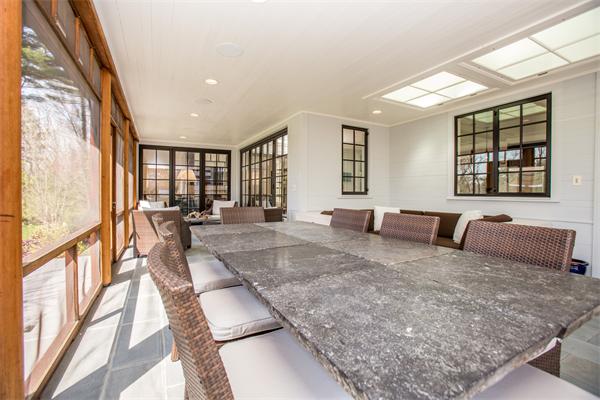 103 Rolling Lane Weston, MA 02493 - Photo 10 of 25 a living room with furniture and a large window
