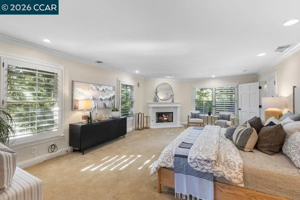 a bedroom with a bed and a chair