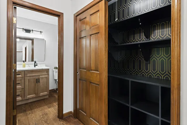 a kitchen with a refrigerator and cabinets