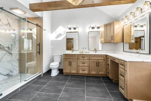 a bathroom with a granite countertop sink mirror and a