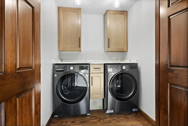 a view of a hallway with washer and dryer