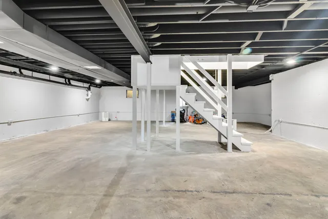 a view of an empty room with stairs