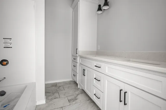 a bathroom with a sink and a bathtub