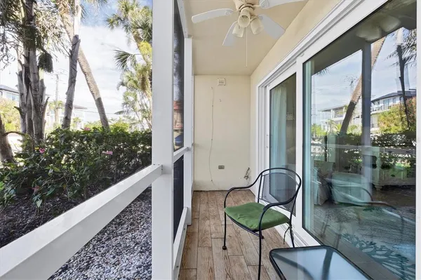 a view of a balcony with furniture