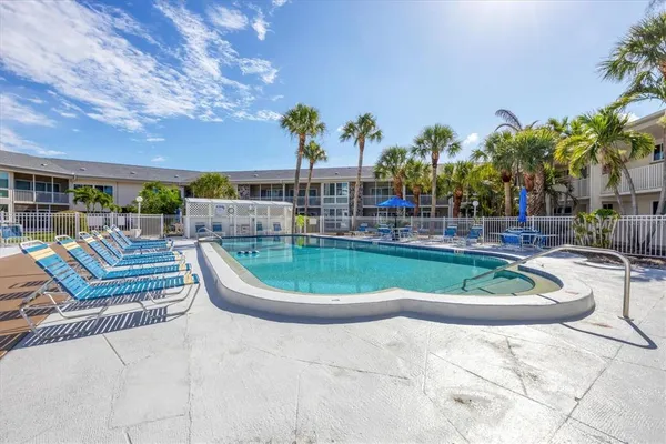 a view of a swimming pool with a patio