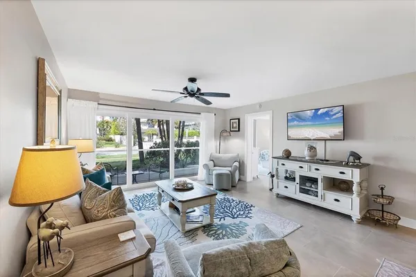 a living room with furniture and a large window