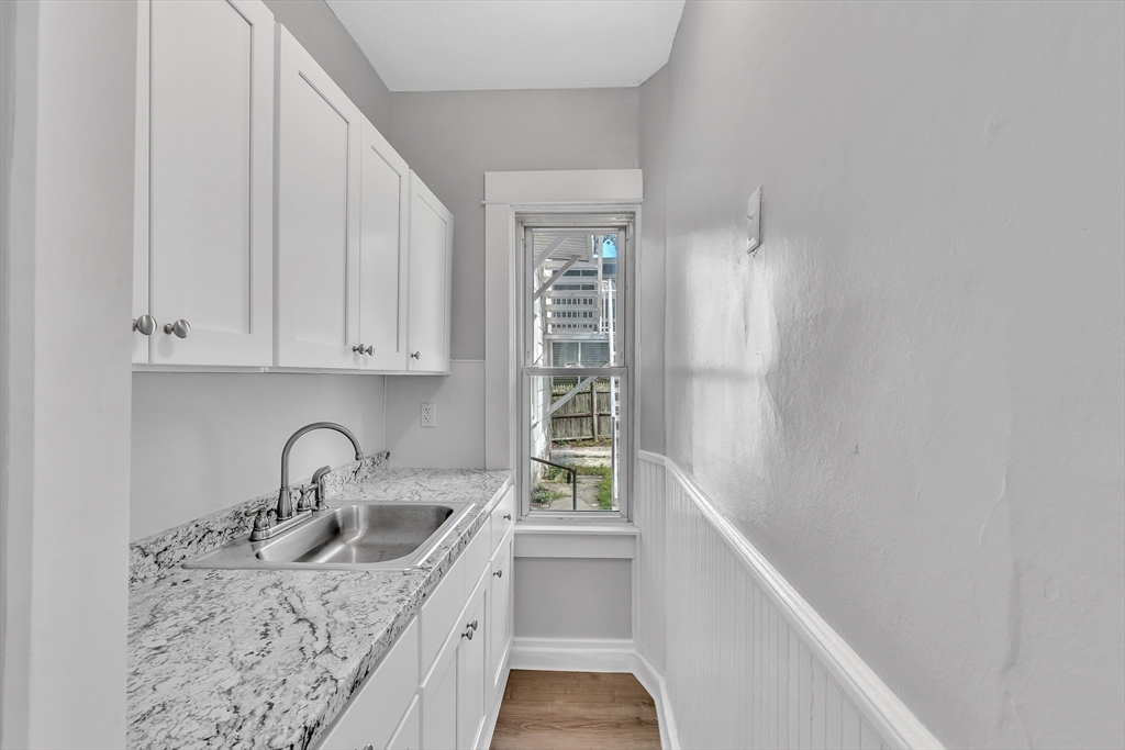 256 Whipple Street Fall River, MA 02721 - Photo 5 of 42 a kitchen with a sink and cabinets