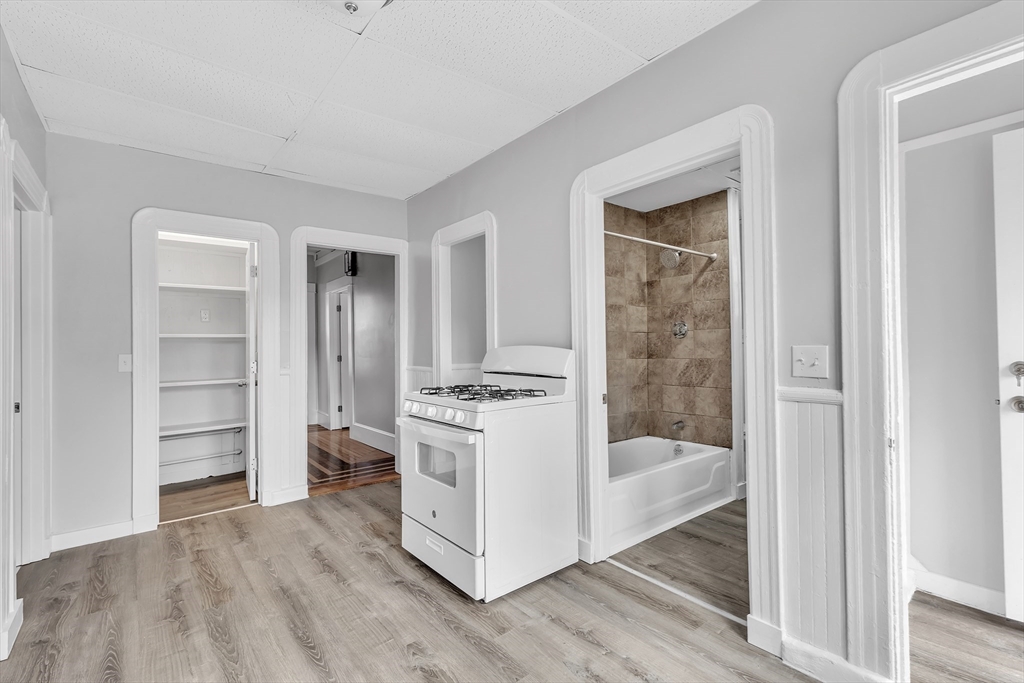 256 Whipple Street Fall River, MA 02721 - Photo 6 of 42 a kitchen with a refrigerator and a stove