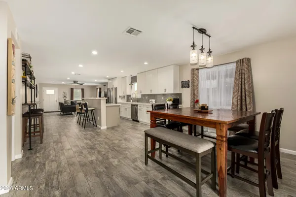 a view of kitchen dining table and chairs