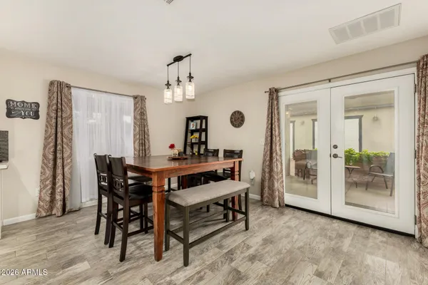 a view of a dining room with furniture and window