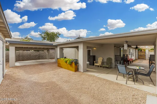 a view of a room with furniture and chandelier