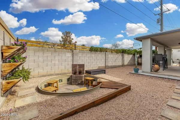 a view of a swimming pool with an outdoor seating