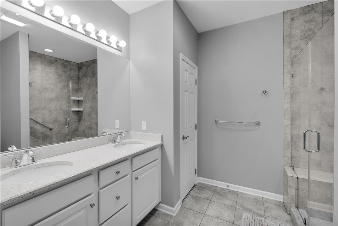 1011 Resolution Drive Bethlehem, PA 18017 - Photo 25 of 49 a spacious bathroom with double sink and a mirror