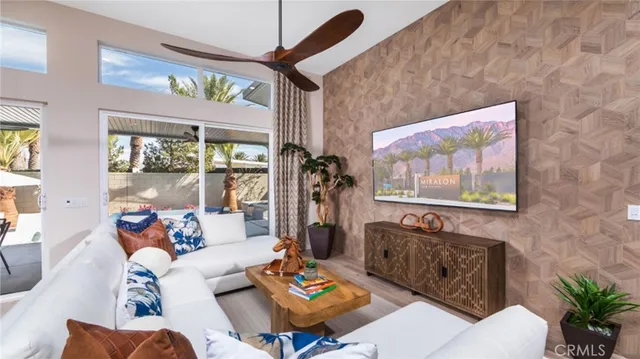a living room with furniture rug and window
