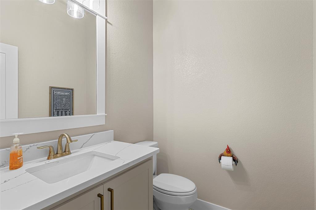 1313 Grn Rdg Road Weatherford, TX 76085 - Photo 17 of 40 Half Bathroom off of the kitchen and breakfast area