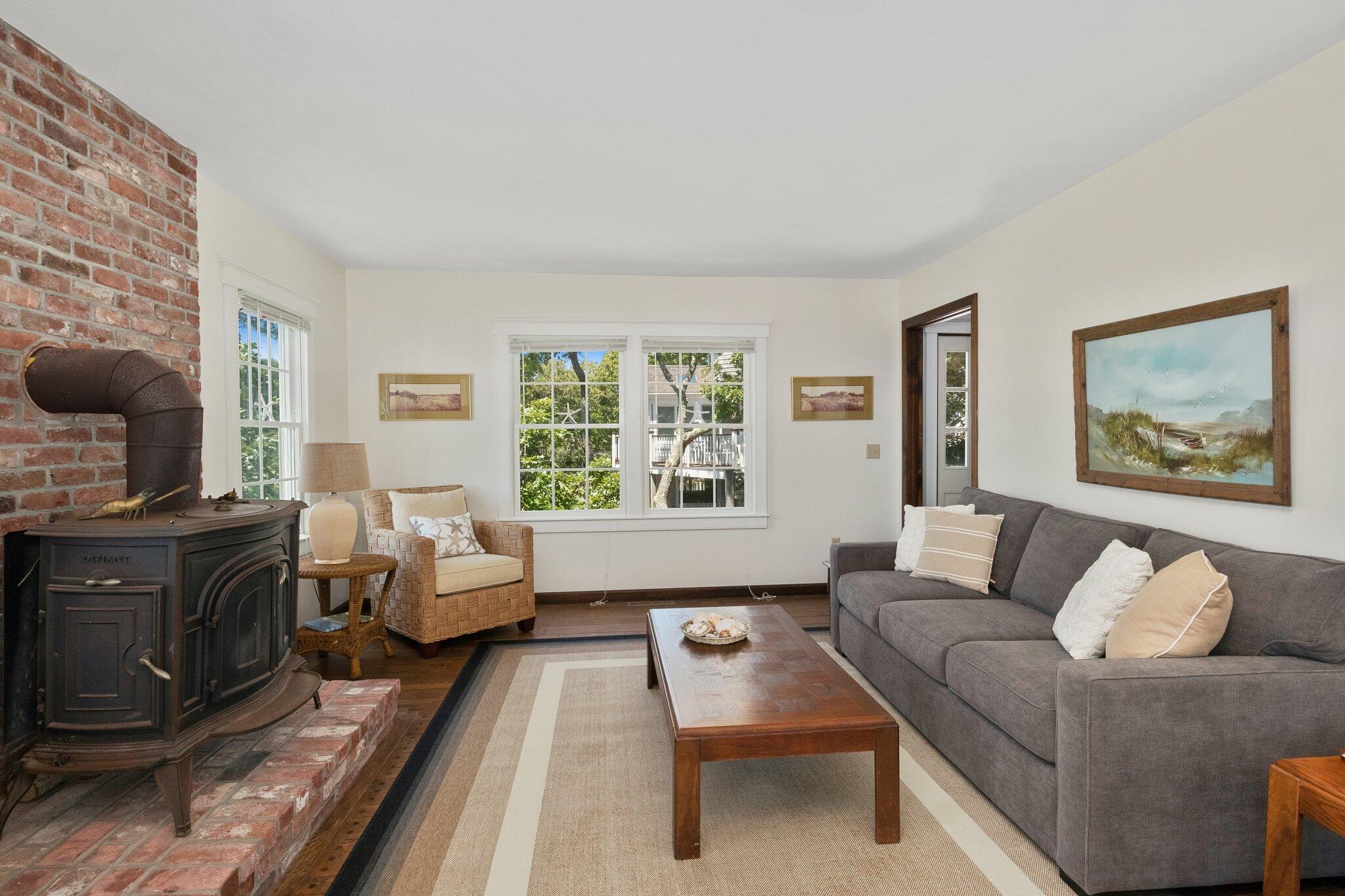 4 Portview Road Chatham, MA 02659 - Photo 12 of 69 a living room with furniture and a fireplace