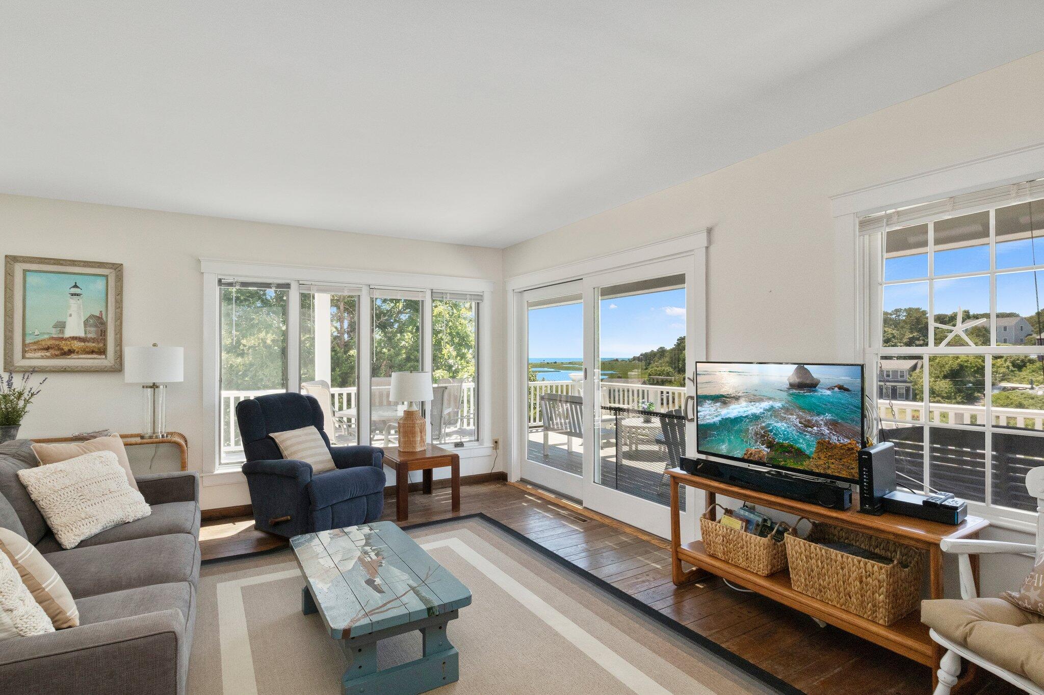 4 Portview Road Chatham, MA 02659 - Photo 13 of 69 a living room with furniture large window and flat screen tv