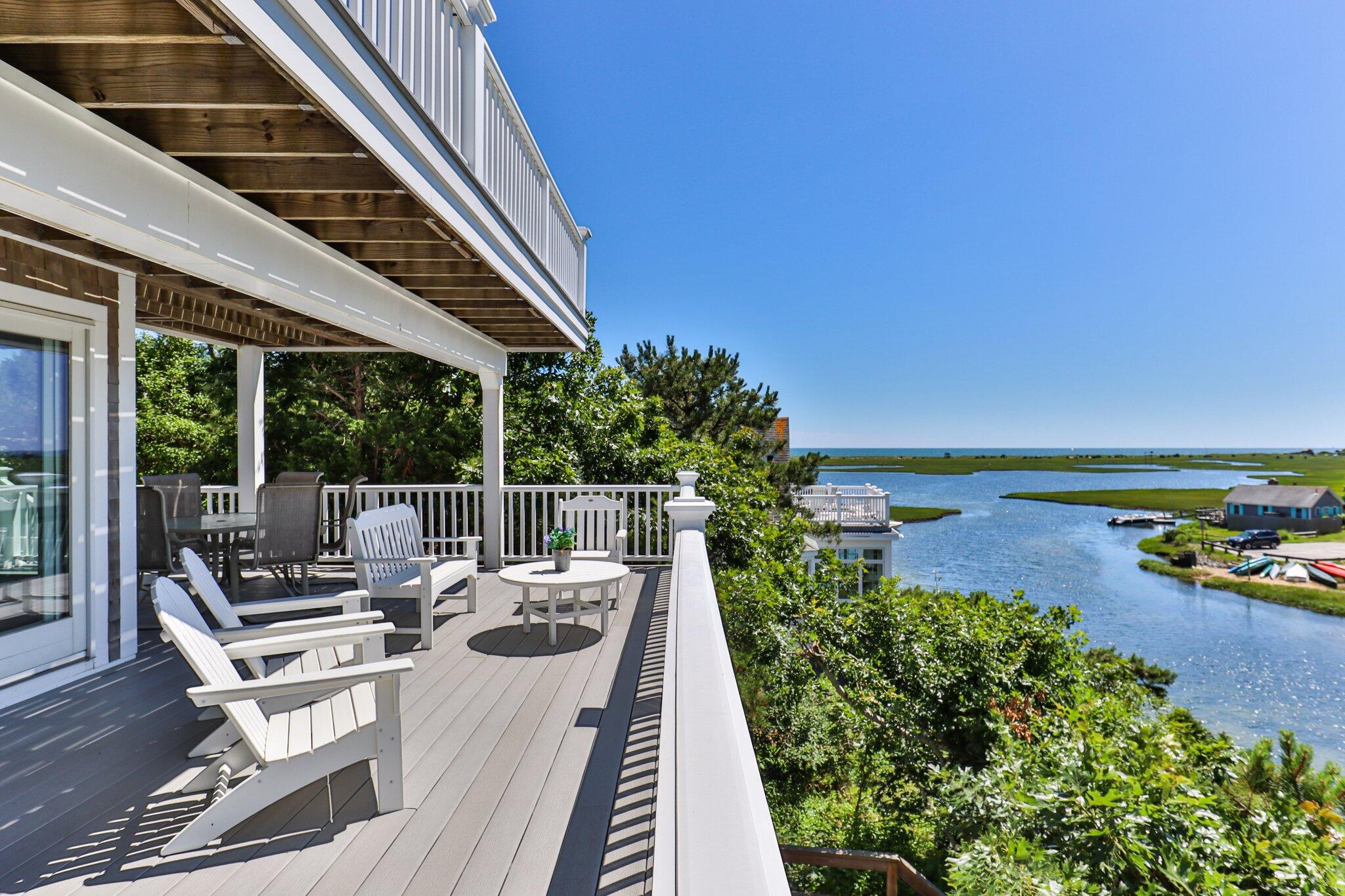 4 Portview Road Chatham, MA 02659 - Photo 16 of 69 a view of a patio with couches table and chairs and potted plants