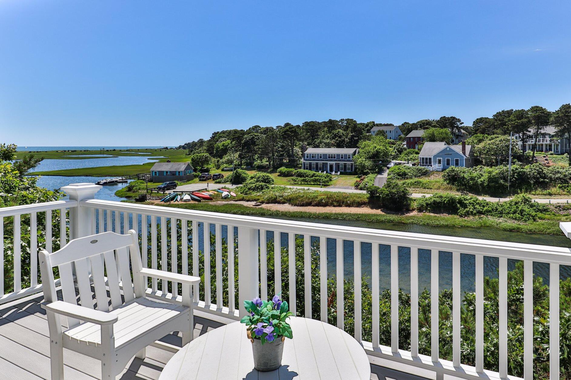 4 Portview Road Chatham, MA 02659 - Photo 17 of 69 a view of a balcony with wooden floor and outdoor seating