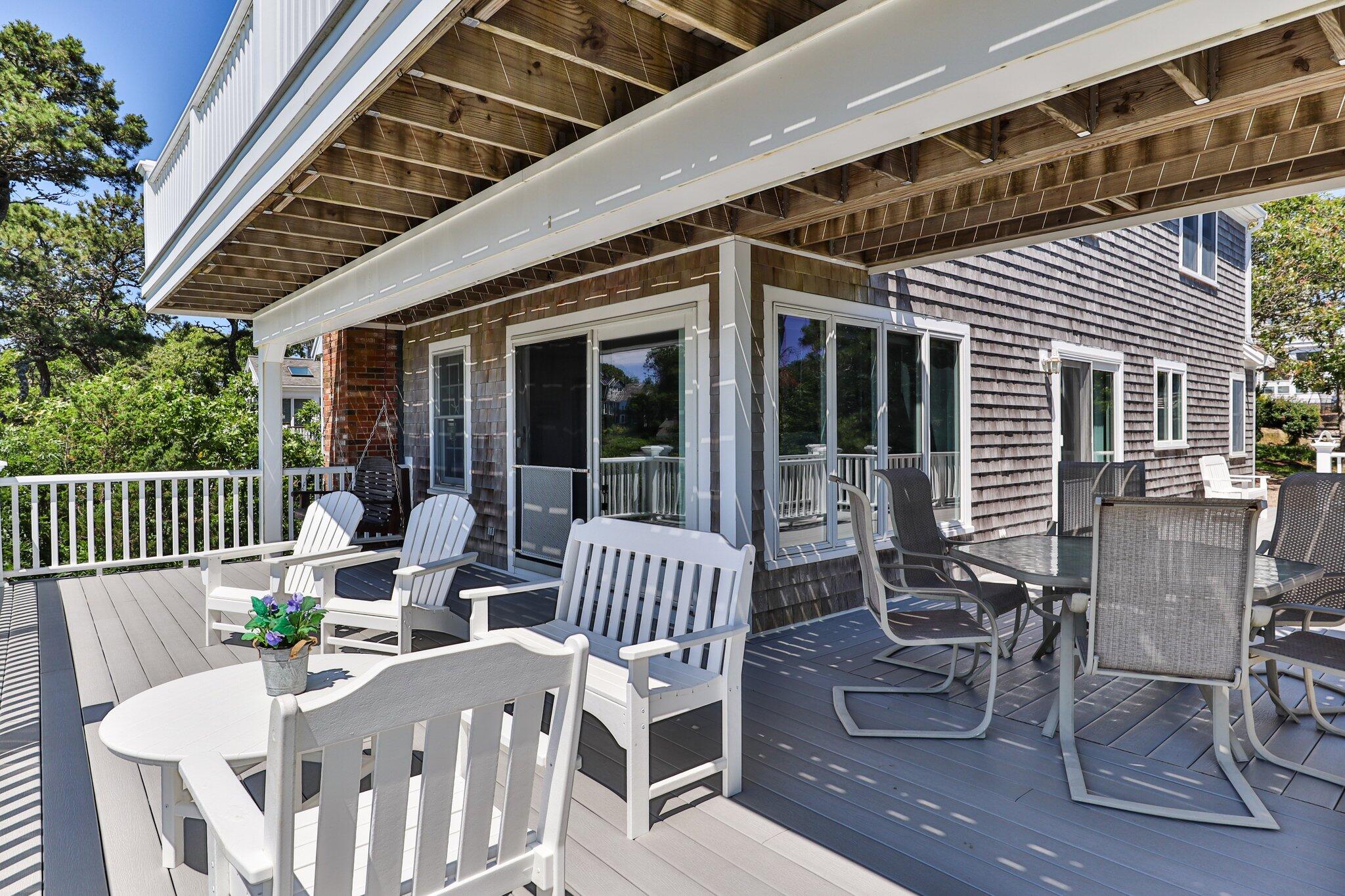 4 Portview Road Chatham, MA 02659 - Photo 19 of 69 a view of a patio with a table and chairs