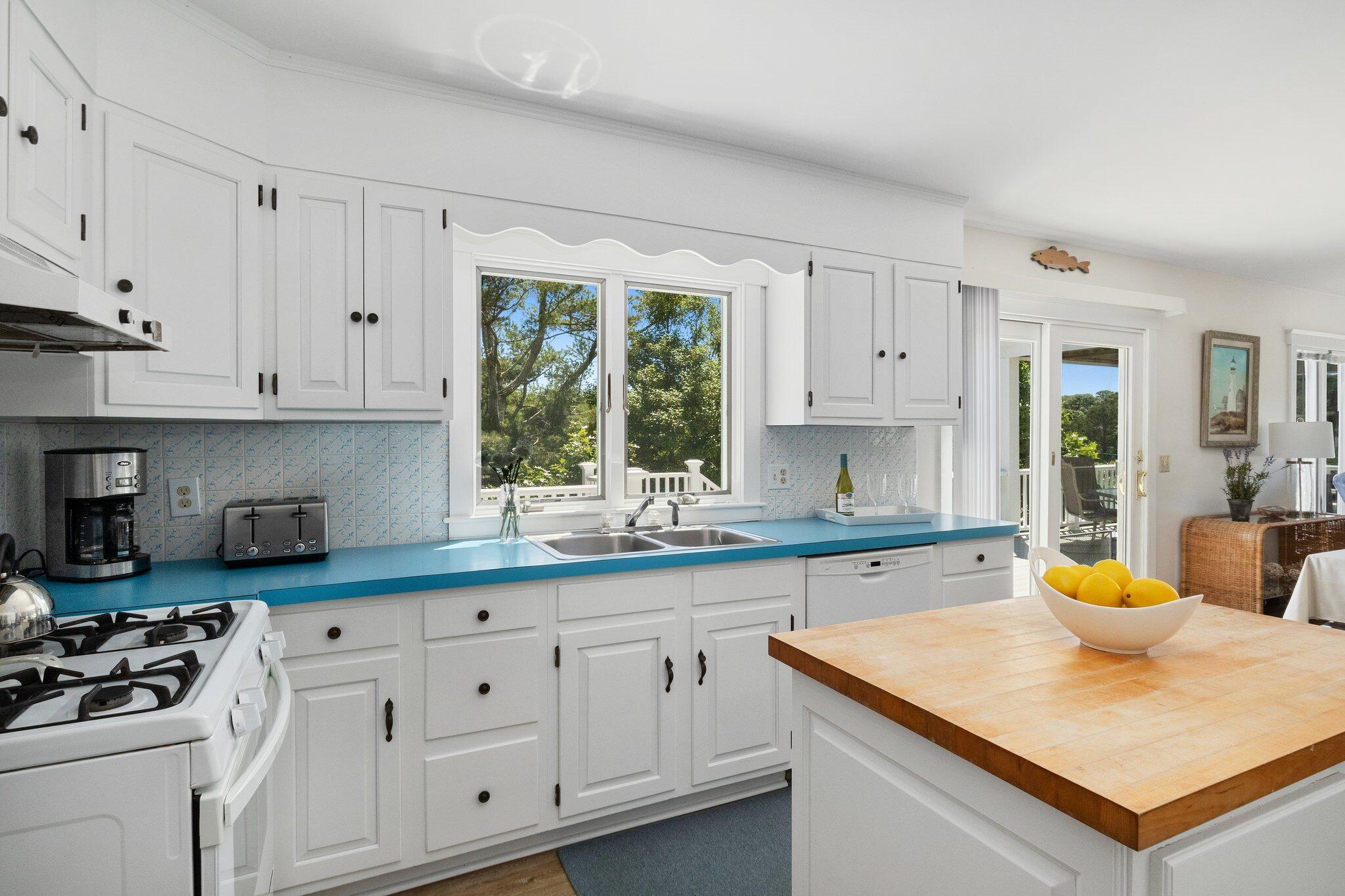 4 Portview Road Chatham, MA 02659 - Photo 23 of 69 a kitchen with white cabinets and white appliances