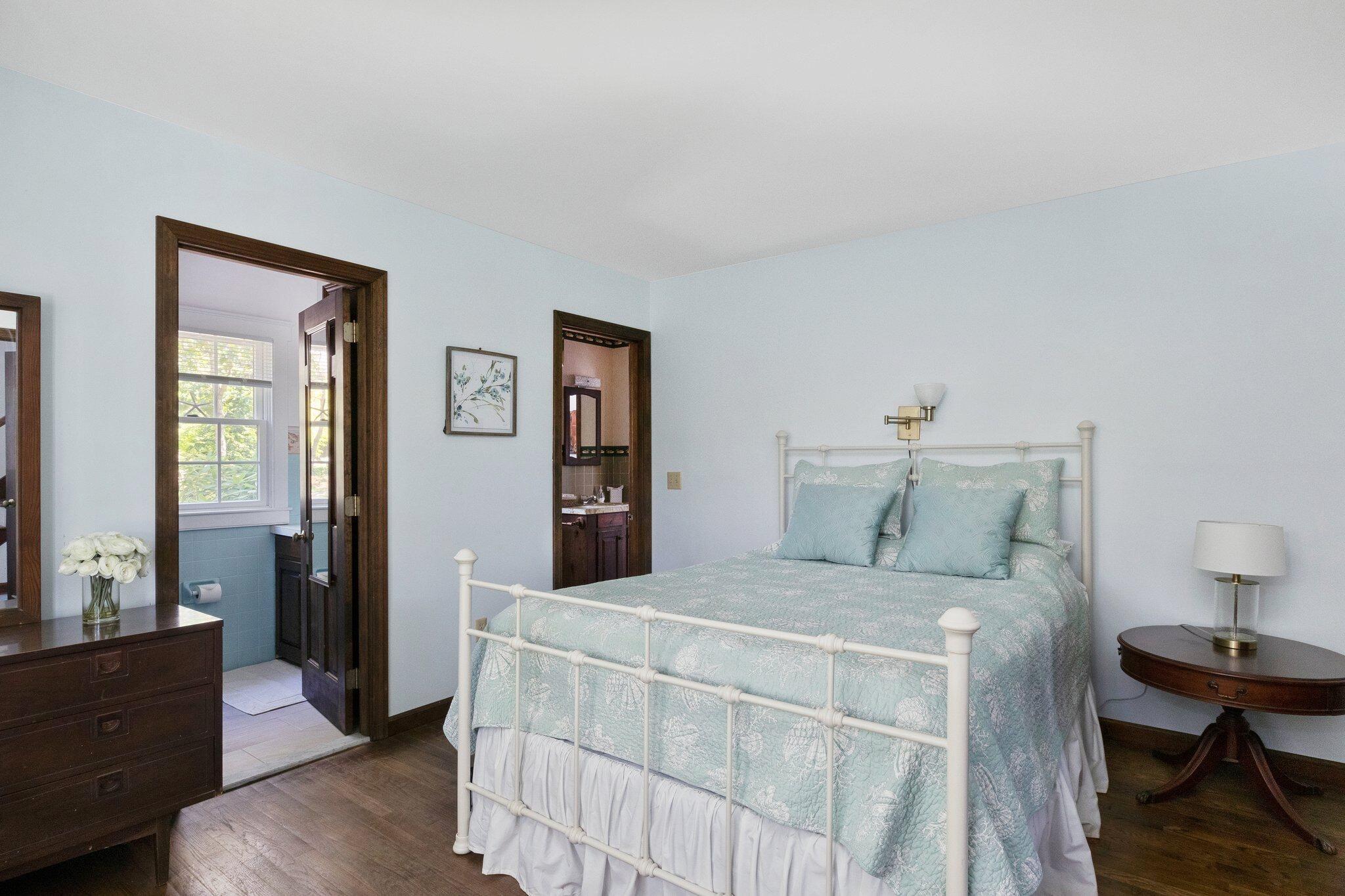 4 Portview Road Chatham, MA 02659 - Photo 29 of 69 a bedroom with a bed and a table in it