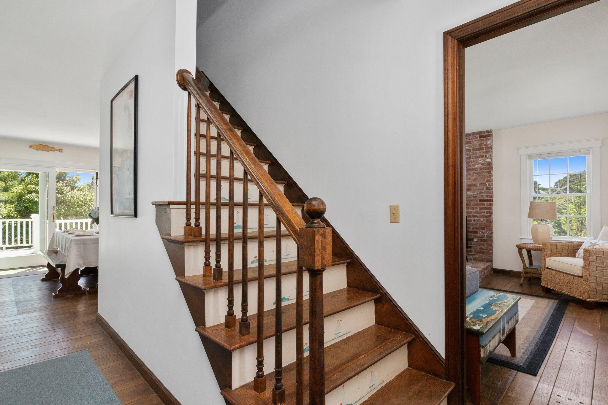 4 Portview Road Chatham, MA 02659 - Photo 35 of 69 a view of staircase with lots of frames on wall and a window