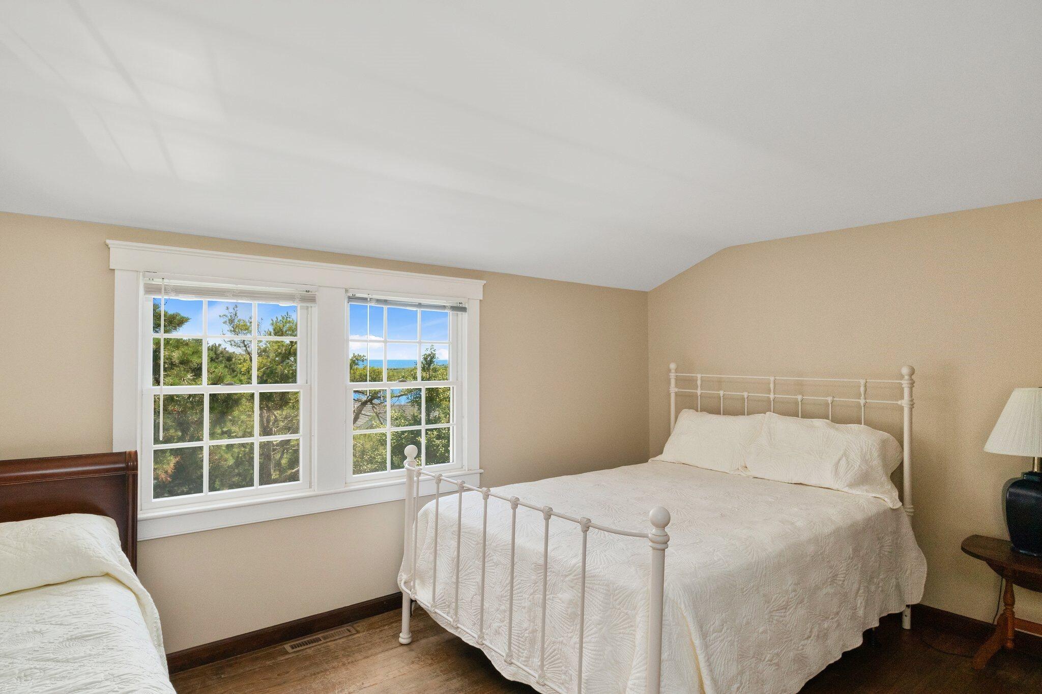 4 Portview Road Chatham, MA 02659 - Photo 40 of 69 a bedroom with a bed and a window with outer view